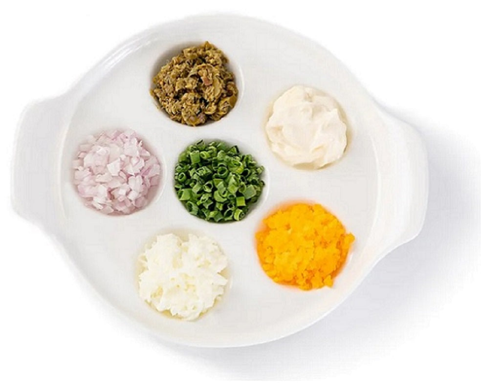 Classic Caviar Condiments, chopped chives, hard-boiled eggs, capers, crème fraîche and diced onions